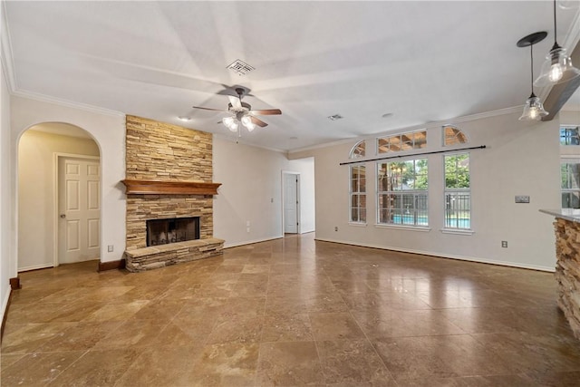 5609 Leicester Dr, Corpus Christi, TX 78414 - unfurnished living room featuring a ceiling fan, a fireplace, arched walkways, and ornamental molding