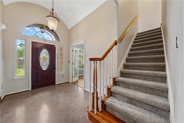 5609 Leicester Dr, Corpus Christi, TX 78414 - entryway featuring a chandelier, healthy amount of natural light, lofted ceiling, and stairs