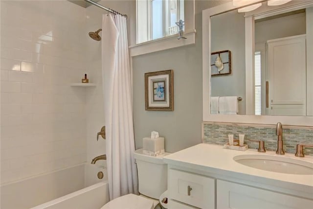 full bathroom with shower / bath combo, toilet, backsplash, and vanity