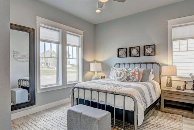 bedroom featuring ceiling fan and light hardwood / wood-style floors