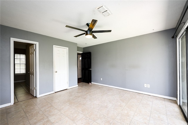 unfurnished bedroom featuring ceiling fan