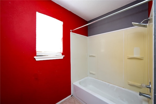 bathroom with tile patterned flooring and  shower combination