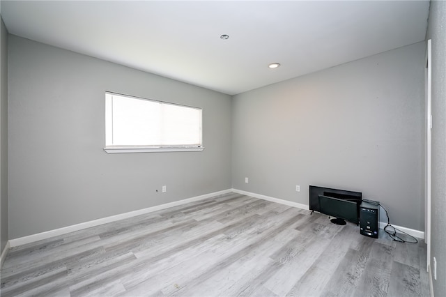 spare room featuring light hardwood / wood-style floors