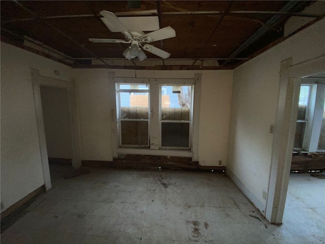 unfurnished room with ceiling fan