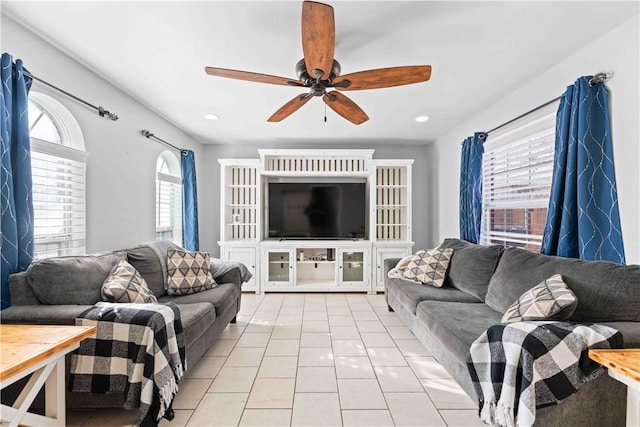 tiled living room featuring ceiling fan