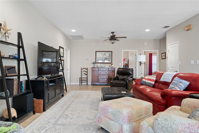 living room featuring light tile patterned floors and ceiling fan