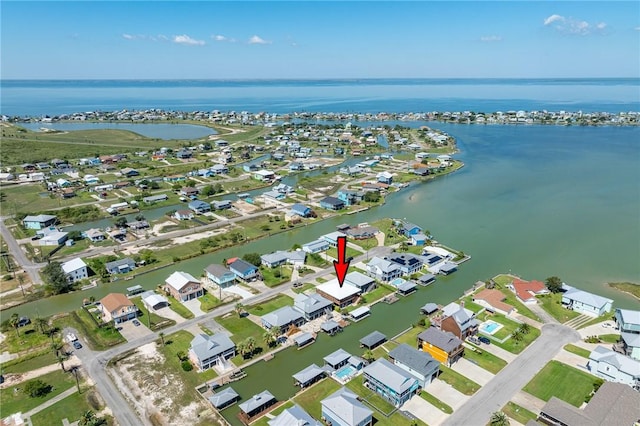 birds eye view of property with a residential view and a water view