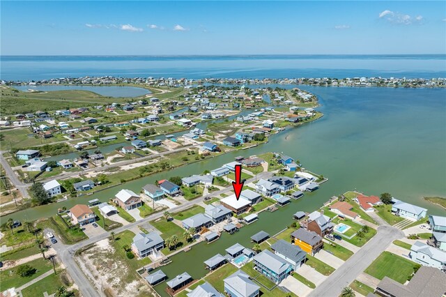 birds eye view of property featuring a water view