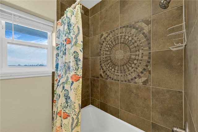 bathroom with shower / bath combo