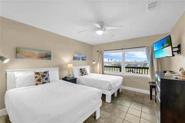 bedroom featuring ceiling fan and light tile patterned flooring