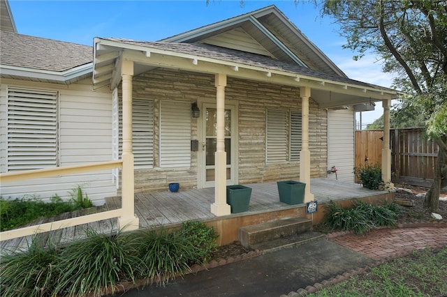 property entrance with covered porch