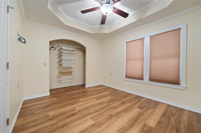 unfurnished bedroom featuring ornamental molding, light hardwood / wood-style floors, and ceiling fan