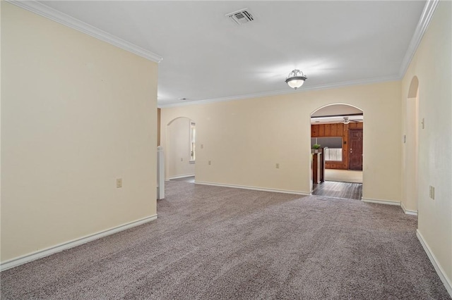 119 N Rife St, Aransas Pass, TX 78336 - unfurnished room featuring arched walkways, crown molding, carpet, and baseboards