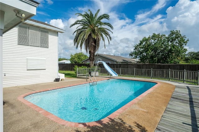 119 N Rife St, Aransas Pass, TX 78336 - view of swimming pool featuring a water slide, a fenced backyard, and a patio