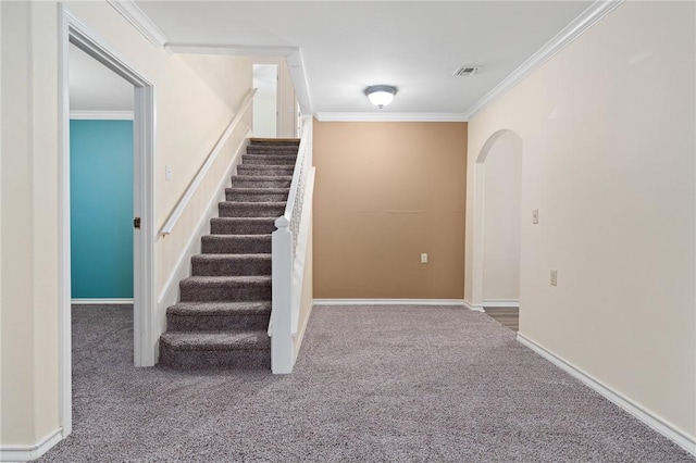 119 N Rife St, Aransas Pass, TX 78336 - staircase with carpet, crown molding, arched walkways, and baseboards