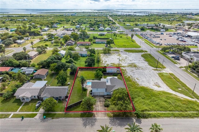 119 N Rife St, Aransas Pass, TX 78336 - aerial perspective of suburban area with property boundaries highlighted and a large body of water