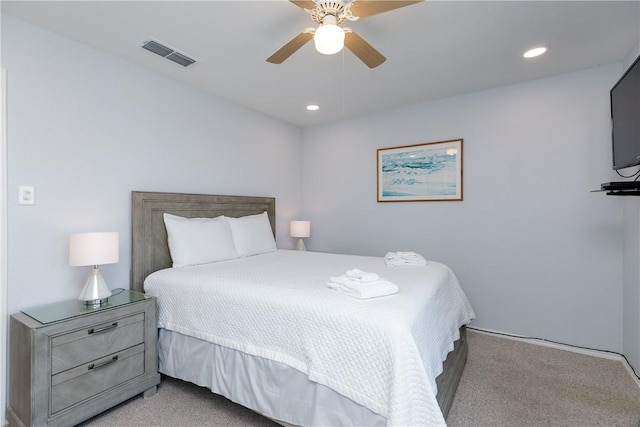 bedroom with light carpet, ceiling fan, visible vents, and recessed lighting