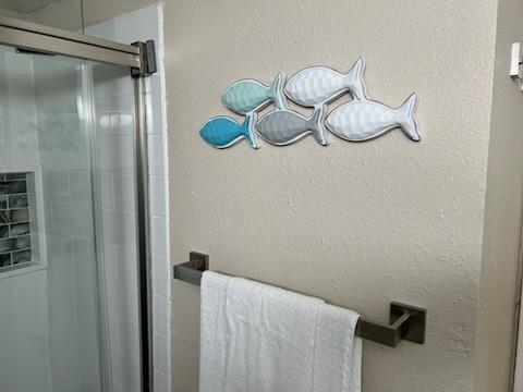 bathroom featuring a shower stall