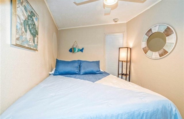 bedroom featuring crown molding and ceiling fan