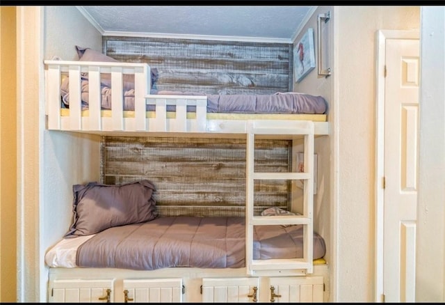 bedroom featuring crown molding