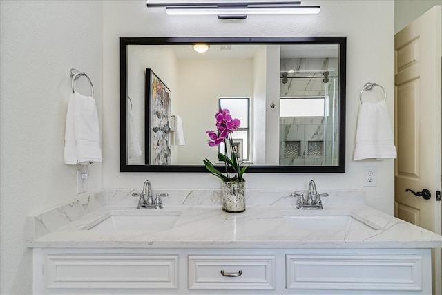 bathroom featuring vanity and an enclosed shower