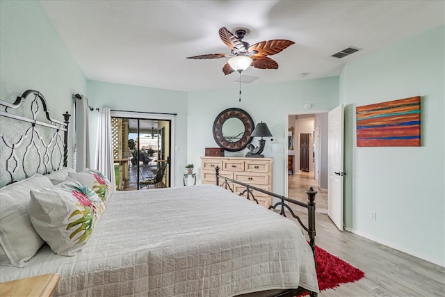 bedroom featuring hardwood / wood-style flooring, ceiling fan, and access to exterior