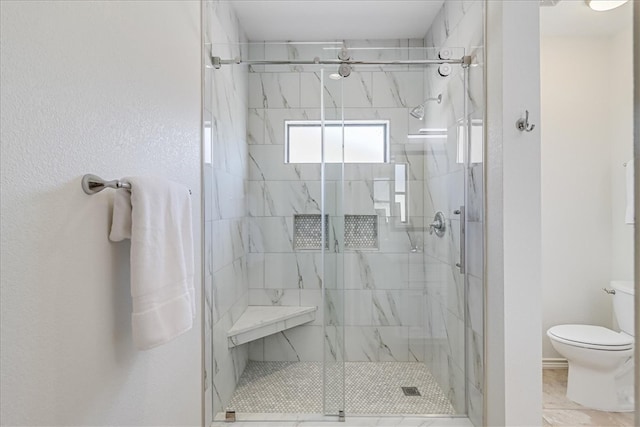 bathroom with toilet and walk in shower