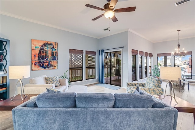 living room with light wood-type flooring, ceiling fan with notable chandelier, and crown molding