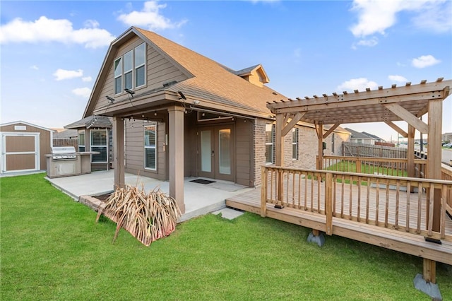 back of house featuring a storage shed, a lawn, a pergola, a patio, and a wooden deck