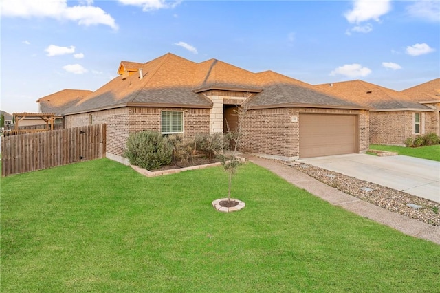 view of front of house with a garage and a front lawn