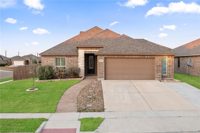 view of front facade featuring a garage and a front lawn