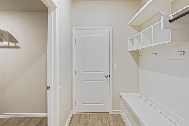 mudroom with light hardwood / wood-style floors