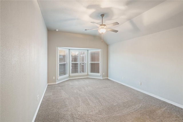 unfurnished room with lofted ceiling, light carpet, and ceiling fan