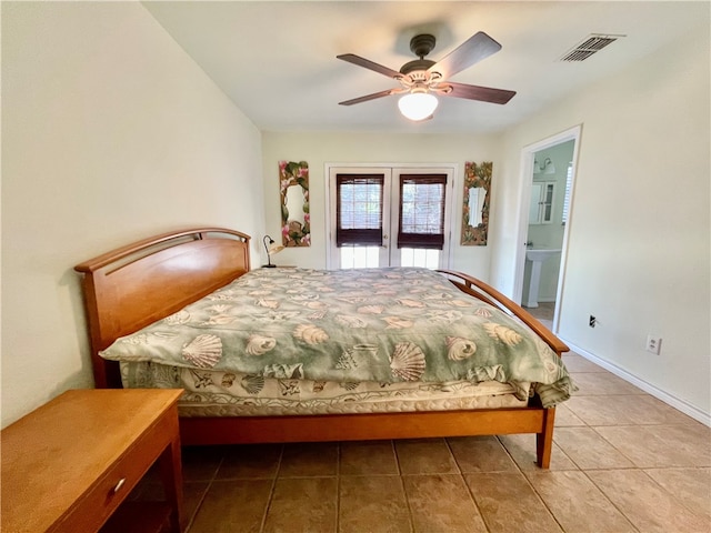 bedroom featuring sink, ensuite bathroom, ceiling fan, light tile patterned floors, and french doors