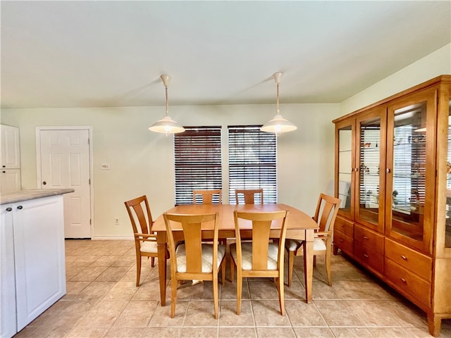 dining area featuring plenty of natural light and light tile patterned floors