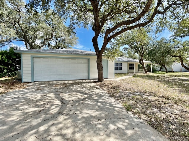 ranch-style home with a garage