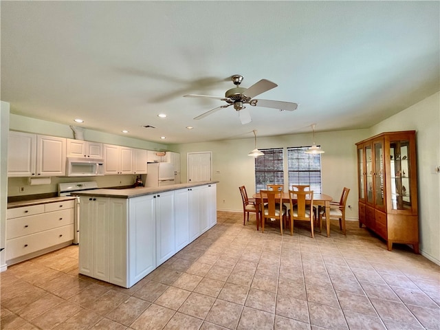 kitchen featuring white appliances, ceiling fan, white cabinetry, and light tile patterned flooring