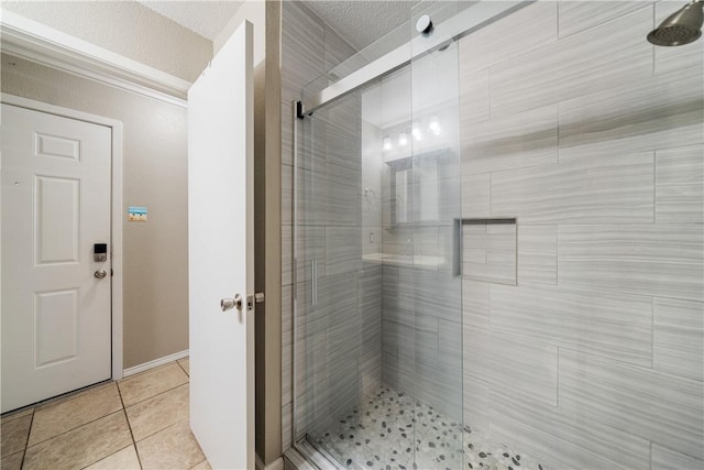 full bath with tile patterned floors and a stall shower