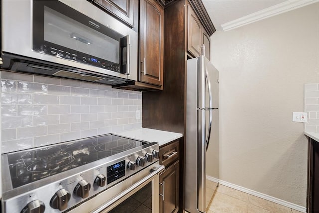 kitchen with backsplash, stainless steel appliances, dark brown cabinetry, crown molding, and light countertops