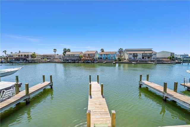 dock area with a residential view and a water view