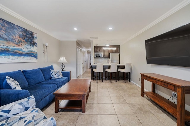 living area with light tile patterned floors, visible vents, recessed lighting, and crown molding