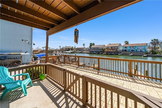 wooden deck featuring a water view