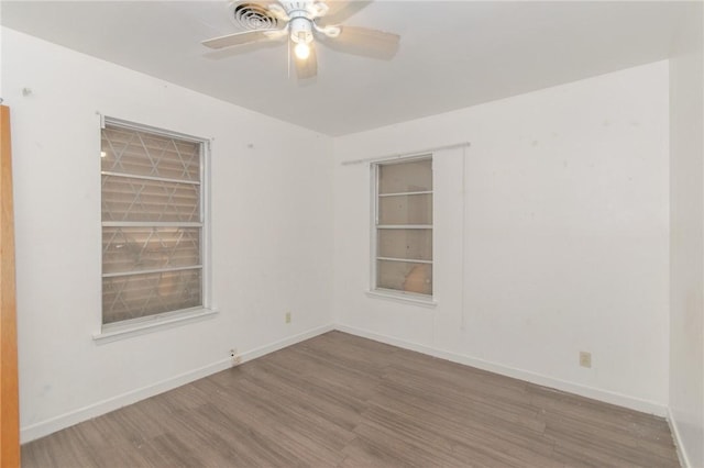 unfurnished room featuring ceiling fan and wood-type flooring