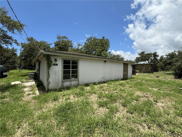 view of home's exterior with a lawn