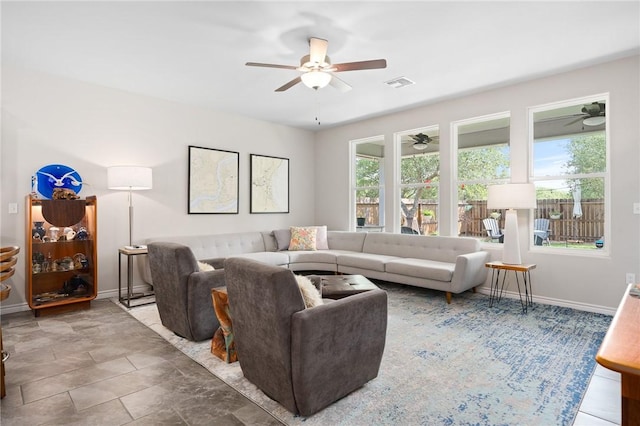 1962 Lighthouse Lakes Ln, Aransas Pass, TX 78336 - living area with ceiling fan, baseboards, and visible vents