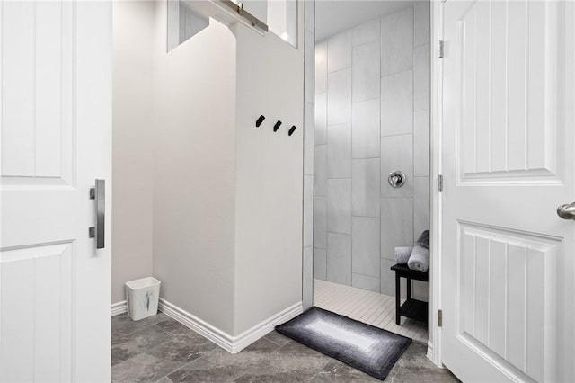 1962 Lighthouse Lakes Ln, Aransas Pass, TX 78336 - bathroom with marble finish floor, baseboards, and a walk in shower