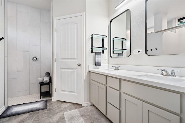 1962 Lighthouse Lakes Ln, Aransas Pass, TX 78336 - full bath with a sink, double vanity, and tiled shower
