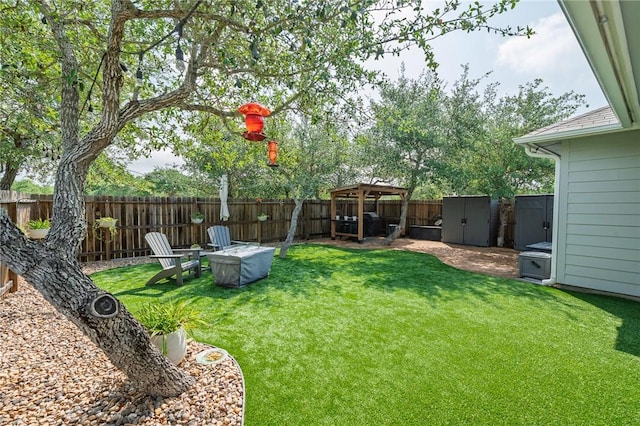 1962 Lighthouse Lakes Ln, Aransas Pass, TX 78336 - view of yard with a fenced backyard, an outbuilding, a gazebo, and a shed