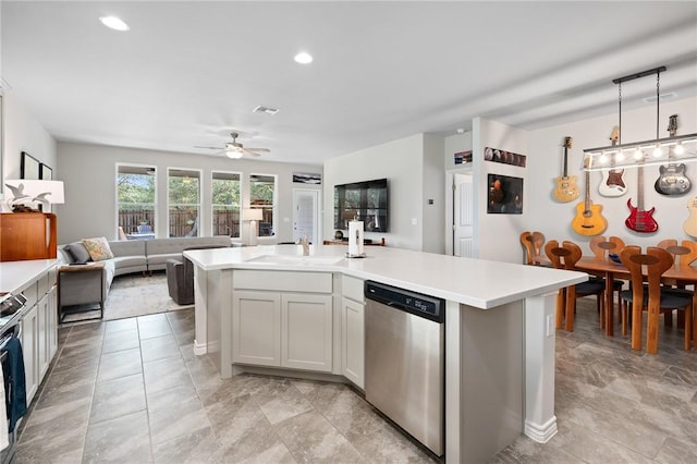 1962 Lighthouse Lakes Ln, Aransas Pass, TX 78336 - kitchen featuring open floor plan, light countertops, appliances with stainless steel finishes, and ceiling fan