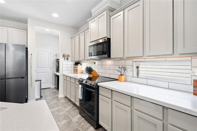 1962 Lighthouse Lakes Ln, Aransas Pass, TX 78336 - kitchen featuring backsplash, recessed lighting, stainless steel appliances, and light countertops